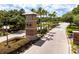 Landscaped entrance to Hernando Oaks community with brick monument sign at 17766 Garsalaso Cir, Brooksville, FL 34604