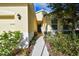 Welcoming front entrance with walkway and lush landscaping at 17766 Garsalaso Cir, Brooksville, FL 34604