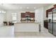 Spacious kitchen with island, stainless steel appliances, and granite countertops at 17766 Garsalaso Cir, Brooksville, FL 34604