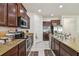 Modern kitchen with stainless steel appliances and granite countertops at 17766 Garsalaso Cir, Brooksville, FL 34604
