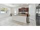 Spacious kitchen with island, stainless steel appliances, and granite countertops at 17766 Garsalaso Cir, Brooksville, FL 34604