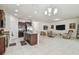 Open kitchen features granite countertops and dark wood cabinetry at 17766 Garsalaso Cir, Brooksville, FL 34604