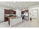 Spacious kitchen with island, stainless steel appliances, and granite countertops at 17766 Garsalaso Cir, Brooksville, FL 34604