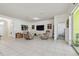Spacious living room with two recliners and large TV at 17766 Garsalaso Cir, Brooksville, FL 34604