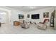 Open living area showcasing a large TV and comfortable seating at 17766 Garsalaso Cir, Brooksville, FL 34604
