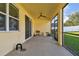 Screened porch with ceiling fan and sliding glass door at 17766 Garsalaso Cir, Brooksville, FL 34604