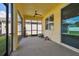 Covered patio with screened enclosure and ceiling fan at 17766 Garsalaso Cir, Brooksville, FL 34604
