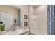 Clean bathroom with shower/tub combo and granite countertop at 18228 Metado Dr, Lakewood Ranch, FL 34211