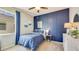 Serene bedroom with blue and white color scheme and shiplap wall at 18228 Metado Dr, Lakewood Ranch, FL 34211