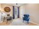 Home office space with built-in clock wall and comfortable seating at 18228 Metado Dr, Lakewood Ranch, FL 34211