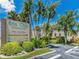 Sea Club Condominiums entrance sign and building view at 19725 Gulf Blvd # 10, Indian Shores, FL 33785