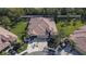Aerial view of a house with a two-car garage and surrounding landscape at 204 Mystic Falls Dr, Apollo Beach, FL 33572