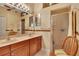 Bathroom with double sinks, large mirror, and walk-in shower at 204 Mystic Falls Dr, Apollo Beach, FL 33572