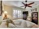 Main bedroom with a king-size bed, a ceiling fan and plenty of natural light at 204 Mystic Falls Dr, Apollo Beach, FL 33572