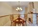 Bright dining room with chandelier and fireplace at 204 Mystic Falls Dr, Apollo Beach, FL 33572