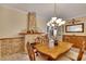 Formal dining room with chandelier and fireplace at 204 Mystic Falls Dr, Apollo Beach, FL 33572