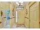 Bright entryway with light walls and wood flooring at 204 Mystic Falls Dr, Apollo Beach, FL 33572
