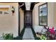 House front door with screen door and walkway at 204 Mystic Falls Dr, Apollo Beach, FL 33572