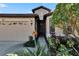 Front entry with landscaping and dark door at 204 Mystic Falls Dr, Apollo Beach, FL 33572