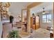 Home office with built-in shelving and view to living room at 204 Mystic Falls Dr, Apollo Beach, FL 33572