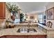 Kitchen boasts a double sink and granite countertops at 204 Mystic Falls Dr, Apollo Beach, FL 33572