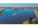 Aerial view of a lake in a residential community at 204 Mystic Falls Dr, Apollo Beach, FL 33572