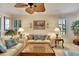 Elegant living room featuring neutral tones and ample natural light at 204 Mystic Falls Dr, Apollo Beach, FL 33572