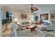 Light and airy living room with comfortable seating and large windows at 204 Mystic Falls Dr, Apollo Beach, FL 33572
