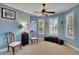 Serene office space with bay window and ceiling fan at 204 Mystic Falls Dr, Apollo Beach, FL 33572