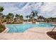 Community pool with surrounding patio at 204 Mystic Falls Dr, Apollo Beach, FL 33572