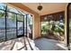 Spacious screened porch overlooking backyard and trees at 204 Mystic Falls Dr, Apollo Beach, FL 33572