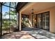 Screened-in porch with sliding glass doors and view of garden at 204 Mystic Falls Dr, Apollo Beach, FL 33572