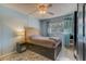 Bedroom with a queen bed, ceiling fan, and ample closet space at 220 Dogwood Cir # 220, Seminole, FL 33777