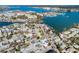 Aerial view of a charming house with a pool, situated in a waterfront neighborhood at 255 146Th Ave E, Madeira Beach, FL 33708