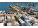 Aerial view showcasing a house near a canal and other houses at 255 146Th Ave E, Madeira Beach, FL 33708