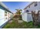 Small backyard with storage shed and room for improvement at 255 146Th Ave E, Madeira Beach, FL 33708