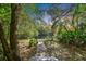 Brick pathway leads to peaceful waterfront view at 2878 Post Rock Dr, Tarpon Springs, FL 34688