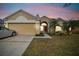 Attractive single-story home with a two-car garage and well-manicured lawn at 30009 Morningmist Dr, Wesley Chapel, FL 33543