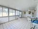 Spacious screened porch with tiled floor and ceiling fan at 3617 S Gardenia Ave, Tampa, FL 33629