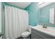 Bathroom with a shower/tub, gray vanity, and a white toilet at 3636 Trophy Blvd # 3636, New Port Richey, FL 34655