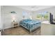 Bedroom with queen bed, window, and neutral decor at 3636 Trophy Blvd # 3636, New Port Richey, FL 34655
