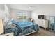 Bedroom with queen bed, window, and neutral decor at 3636 Trophy Blvd # 3636, New Port Richey, FL 34655