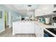Open concept kitchen with white cabinets and island at 3636 Trophy Blvd # 3636, New Port Richey, FL 34655