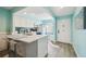 Open concept kitchen with white cabinets and breakfast bar at 3636 Trophy Blvd # 3636, New Port Richey, FL 34655