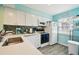 White kitchen with stainless steel appliances and quartz countertops at 3636 Trophy Blvd # 3636, New Port Richey, FL 34655