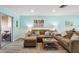 Living area with brown sectional sofa and sliding glass doors at 3636 Trophy Blvd # 3636, New Port Richey, FL 34655