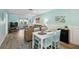 Living room with brown sectional sofa and adjacent dining area at 3636 Trophy Blvd # 3636, New Port Richey, FL 34655