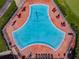 Triangular pool with surrounding patio furniture at 3636 Trophy Blvd # 3636, New Port Richey, FL 34655