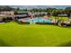 Putting green adjacent to kidney-shaped pool at 3636 Trophy Blvd # 3636, New Port Richey, FL 34655