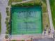 Two tennis courts with pickleball lines, surrounded by green space at 3636 Trophy Blvd # 3636, New Port Richey, FL 34655